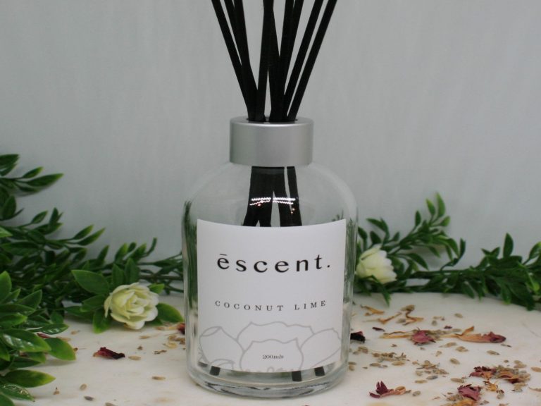 Coconut Lime reed diffuser with silver lid and black reeds