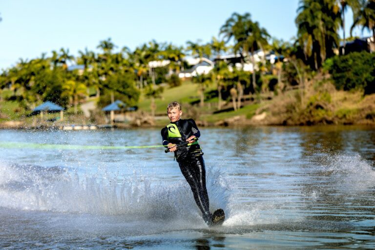 Teenager water-skiing on the Clarence River, with BIG4 Big River in the background
